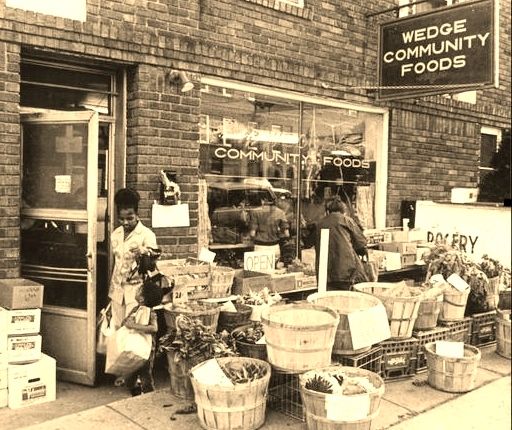 Shoppers at a storefront labeled Wedge Community Foods